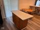 Dining area with table, chairs and kitchen island near sliding glass doors at 4912 Atlanta St, Anderson, IN 46013
