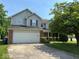 Charming two-story home with a two-car garage and well-maintained lawn at 4912 Atlanta St, Anderson, IN 46013
