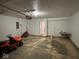 Spacious two car garage featuring bright lighting and access to the home's interior at 4912 Atlanta St, Anderson, IN 46013