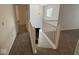 Hallway with staircase and railing and a window that brings in natural light at 4912 Atlanta St, Anderson, IN 46013