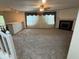 Spacious living room featuring a fireplace and ample natural light at 4912 Atlanta St, Anderson, IN 46013
