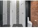 Walk-in shower with decorative tile and glass door in modern bathroom at 501 Fletcher Ave # A, Indianapolis, IN 46203