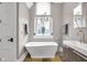 Luxurious bathroom featuring a standalone tub, modern fixtures, and stylish decor at 501 Fletcher Ave # A, Indianapolis, IN 46203