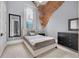 Bedroom features a large window with exposed brick, and a modern minimalist decor at 501 Fletcher Ave # A, Indianapolis, IN 46203