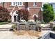 Beautiful brick building with unique architectural details, surrounded by lush landscaping at 501 Fletcher Ave # A, Indianapolis, IN 46203