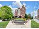 Beautiful brick building with architectural details, blue skies, and colorful landscaping at 501 Fletcher Ave # A, Indianapolis, IN 46203
