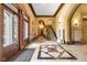 Stunning entryway with travertine floors, arched doorways, and elegant staircase at 501 Fletcher Ave # A, Indianapolis, IN 46203