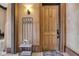 Foyer with coat rack, welcome mat, and a wooden door labeled A at 501 Fletcher Ave # A, Indianapolis, IN 46203