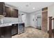 Hallway with beverage center, utility hooks and access to staircase at 501 Fletcher Ave # A, Indianapolis, IN 46203