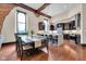 Open-concept kitchen and dining area with stainless steel appliances and modern fixtures at 501 Fletcher Ave # A, Indianapolis, IN 46203