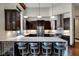Spacious kitchen boasts dark cabinets, stainless steel appliances, and a large center island with seating at 501 Fletcher Ave # A, Indianapolis, IN 46203