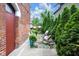 Charming patio area with rocking chairs, privacy hedges, and brick accents at 501 Fletcher Ave # A, Indianapolis, IN 46203