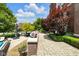 Charming outdoor patio, surrounded by mature trees and colorful flowers at 501 Fletcher Ave # A, Indianapolis, IN 46203