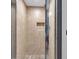 Modern shower featuring neutral tile, niche and glass door at 501 Fletcher Ave # A, Indianapolis, IN 46203