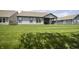 A gray single-Gathering home with a covered patio and large, tree-lined lawn at 5081 Holborn Ave, McCordsville, IN 46055
