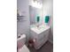 The bathroom features a toilet, vanity with sink, framed mirror, and updated finishes at 5081 Holborn Ave, McCordsville, IN 46055