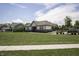 Community clubhouse with landscaped grounds and ample parking for residents at 5081 Holborn Ave, McCordsville, IN 46055