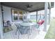 Inviting covered patio with outdoor seating, ceiling fan, and swing, perfect for relaxing and entertaining at 5081 Holborn Ave, McCordsville, IN 46055