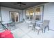 Inviting covered patio with outdoor seating and open access to the main interior of the home at 5081 Holborn Ave, McCordsville, IN 46055
