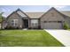 Charming single-story brick home featuring a well-manicured lawn and attached two-car garage at 5081 Holborn Ave, McCordsville, IN 46055