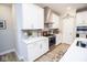 Kitchen showcasing stainless steel appliances, white cabinets, grey backsplash and solid surface countertops at 5081 Holborn Ave, McCordsville, IN 46055