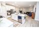 Open concept kitchen and living room features modern stainless appliances and a view into the Gathering room at 5081 Holborn Ave, McCordsville, IN 46055