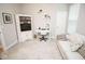 A cozy living room with a sofa, desk, and display shelves offers a comfortable space at 5081 Holborn Ave, McCordsville, IN 46055