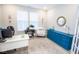 The office area includes a desk and chair, wood flooring, and large windows at 5081 Holborn Ave, McCordsville, IN 46055
