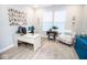 The office area includes a desk and chair, wood flooring, and large windows at 5081 Holborn Ave, McCordsville, IN 46055