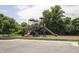 Community playground with multiple slides, play structures, and mature trees, perfect for outdoor Gathering fun at 5081 Holborn Ave, McCordsville, IN 46055