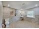 Modern bathroom featuring tile flooring, a walk-in shower, and natural light at 5226 W Southport Rd, Indianapolis, IN 46221