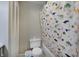 This bathroom features a toilet, dinosaur shower curtain, and white-painted closet at 5226 W Southport Rd, Indianapolis, IN 46221