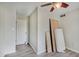 Light-filled bedroom featuring wood-look floors, ceiling fan, and closet at 5226 W Southport Rd, Indianapolis, IN 46221
