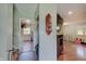Open entryway featuring wood floors and a view into the living spaces and kitchen at 5226 W Southport Rd, Indianapolis, IN 46221