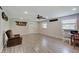 Inviting living room with a ceiling fan, neutral walls, and modern flooring at 5226 W Southport Rd, Indianapolis, IN 46221
