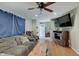 Cozy living room featuring a comfortable sofa, hardwood floors, and natural lighting at 5226 W Southport Rd, Indianapolis, IN 46221