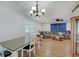 Open-concept living space with hardwood floors, neutral walls, and a comfortable gray sofa at 5226 W Southport Rd, Indianapolis, IN 46221