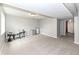 Finished basement with neutral walls and flooring, ideal for customization and various uses at 5826 Winding Way Ln, Indianapolis, IN 46220
