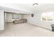 Spacious finished basement featuring plush carpeting and a comfortable seating area at 5826 Winding Way Ln, Indianapolis, IN 46220