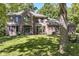 Beautiful brick home with a well manicured lawn and mature trees at 5826 Winding Way Ln, Indianapolis, IN 46220