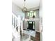 Bright foyer with a modern chandelier and hardwood floors at 5826 Winding Way Ln, Indianapolis, IN 46220