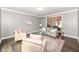 Cozy living room with neutral tones and hardwood floors at 5826 Winding Way Ln, Indianapolis, IN 46220