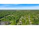 An aerial view of the neighborhood with mature trees and nearby parking at 5850 E 54Th Pl, Indianapolis, IN 46226