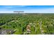 An aerial view of the neighborhood with mature trees and Fort Harrison State Park nearby at 5850 E 54Th Pl, Indianapolis, IN 46226