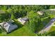 An aerial view of the property featuring a well maintained lawn and mature trees at 5850 E 54Th Pl, Indianapolis, IN 46226