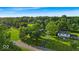 Aerial view of a charming home nestled among lush greenery and mature trees at 5850 E 54Th Pl, Indianapolis, IN 46226