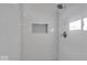 Modern bathroom with white subway tile shower, rainfall showerhead, and built-in niche at 5850 E 54Th Pl, Indianapolis, IN 46226