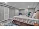 Finished basement bedroom with a queen bed and decorative rug at 5850 E 54Th Pl, Indianapolis, IN 46226
