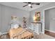 Bedroom featuring a cozy bed, décor, and plenty of natural light from a window at 5850 E 54Th Pl, Indianapolis, IN 46226