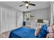 A well-lit bedroom with a crib, large windows, and neutral color palette at 5850 E 54Th Pl, Indianapolis, IN 46226